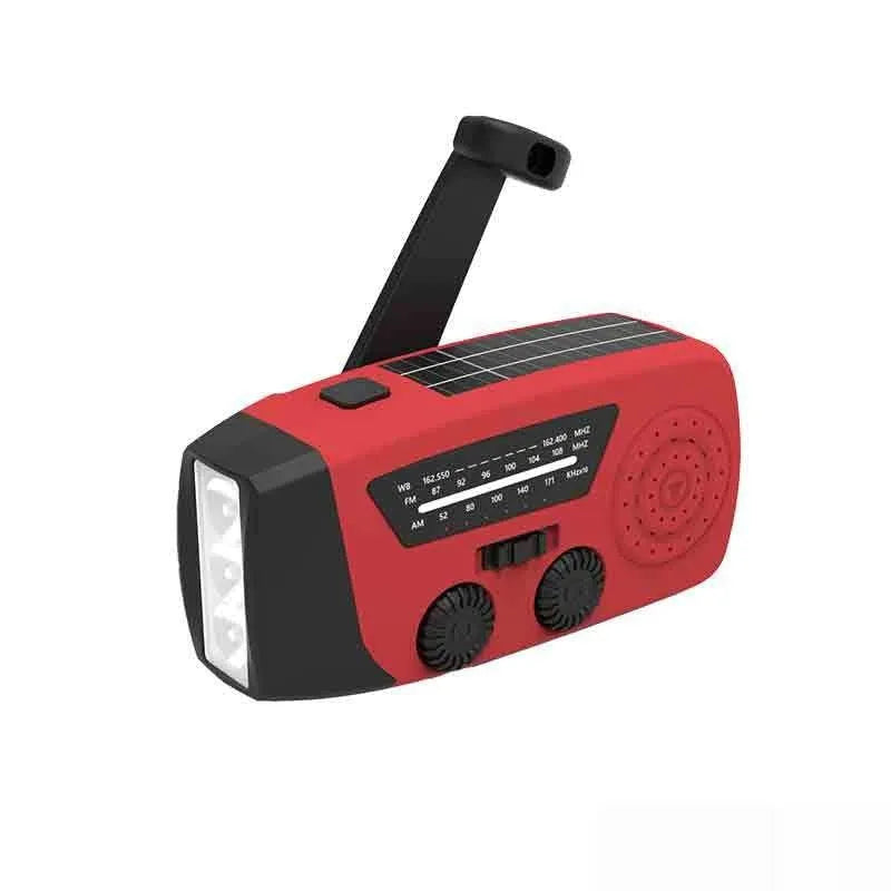 Red rechargeable emergency hand radio with LED torch, built-in speaker, and wrist strap for disaster preparedness