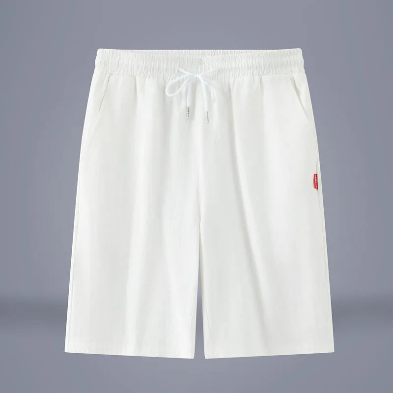 Cotton-linen blend cropped pants in a solid colour with a drawstring waist, shown in a mid-length cut.