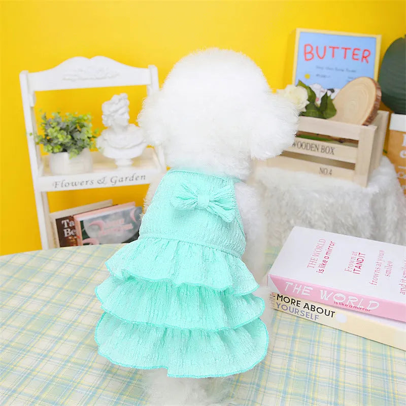Small dog wearing princess dress with candy layered skirt in rose red colour, designed for thin teddy bichon breeds