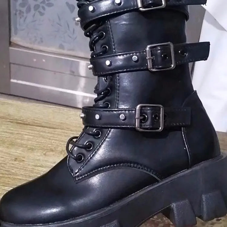 Women's black mid-calf boots with a metal buckle strap and side zipper, made of artificial PU leather.