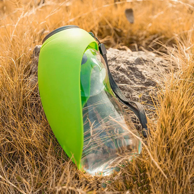 Blue portable pet water bottle with fold-out drinking bowl and carabiner clip for outdoor use