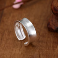 Geometric adjustable open ring with frosted sterling silver finish and Korean-inspired design