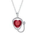 Women's copper necklace with cross, wings, and stethoscope charm in red diamond colour.