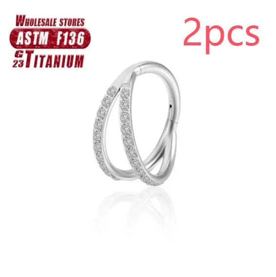 Titanium alloy nose ring in silver, available in plain or diamond-set styles and multiple lengths.