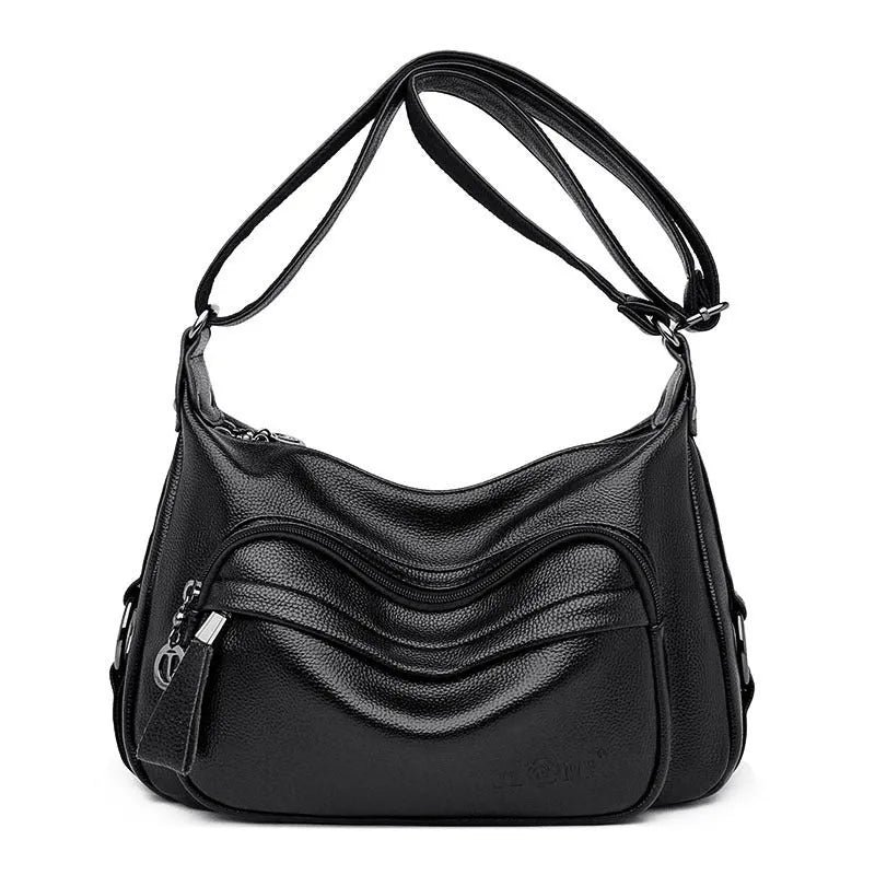 Women's blue soft PU crossbody bag showing interior phone and document compartments with zipper closure