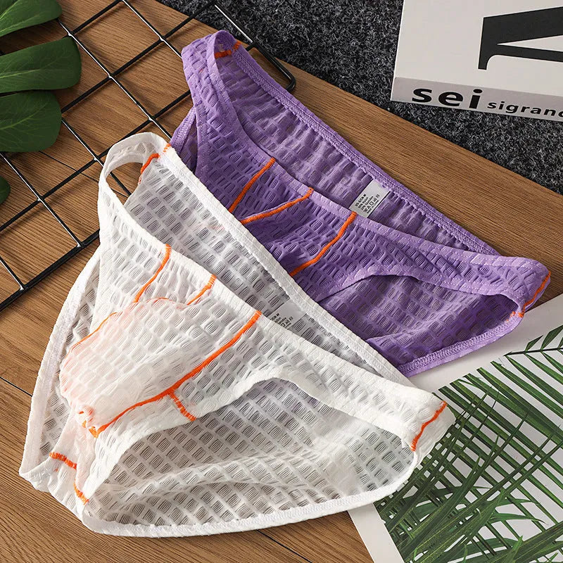 Men's white ice silk lace low waist briefs laid flat, showing the solid colour and lace fabric texture.