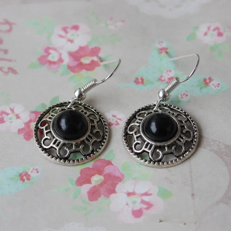 Geometric turquoise flower disk earrings in Miao silver with ethnic patterns