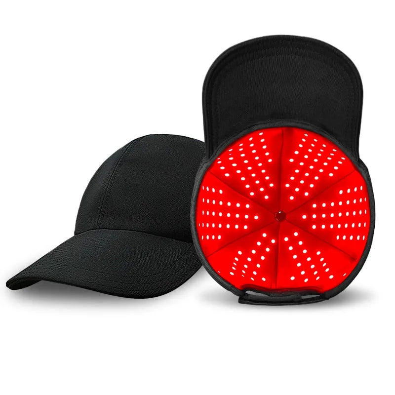 Black infrared peaked cap for hair growth with LED light strip and separate controller.