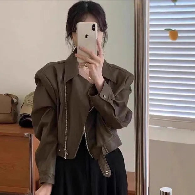 Brown women's retro slim-fit leather coat jacket with long sleeves and pockets.