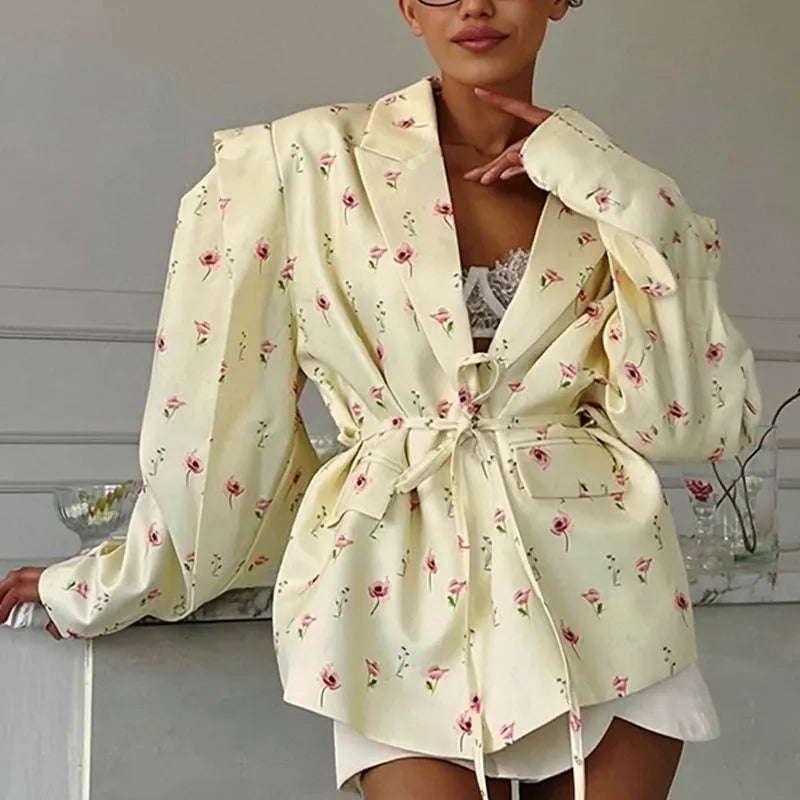 Women's white suit jacket with lace-up waist detail and regular long sleeves
