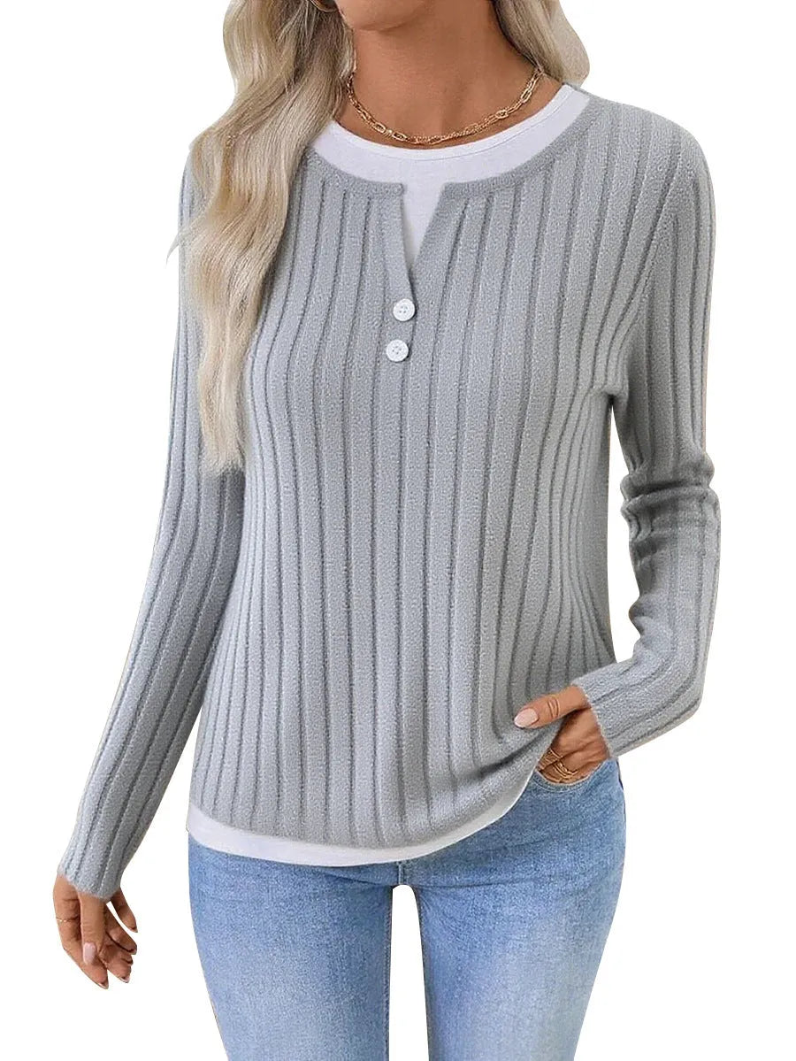 Women's black fake two-piece pullover sweater with round neck and long sleeves.