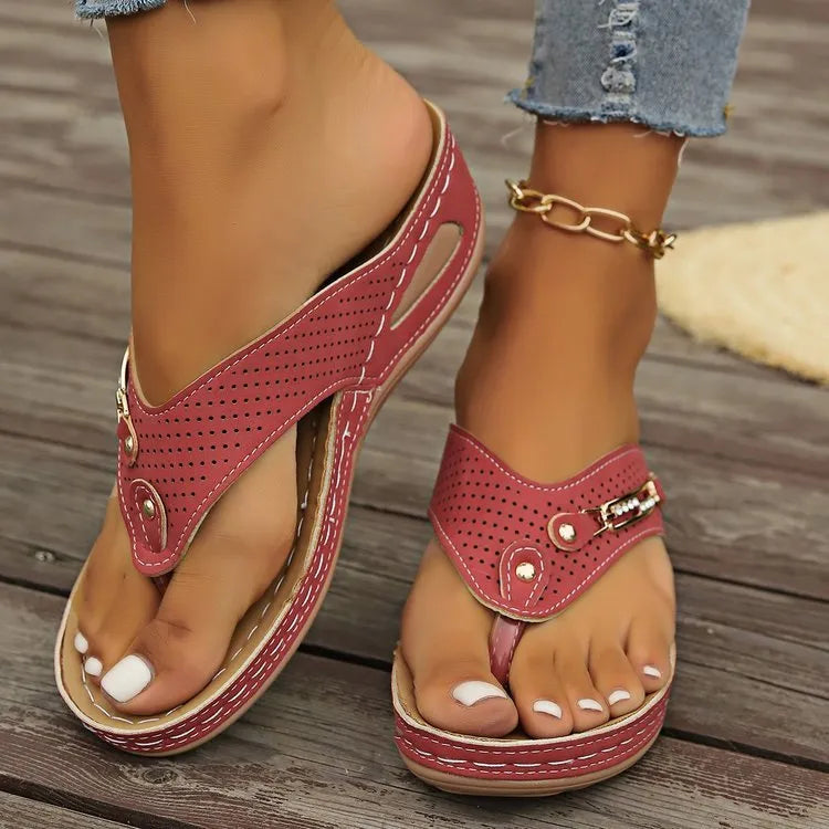 Women's retro-style flip-flop sandals with a herringbone pattern on the strap, shown in a light brown colour.