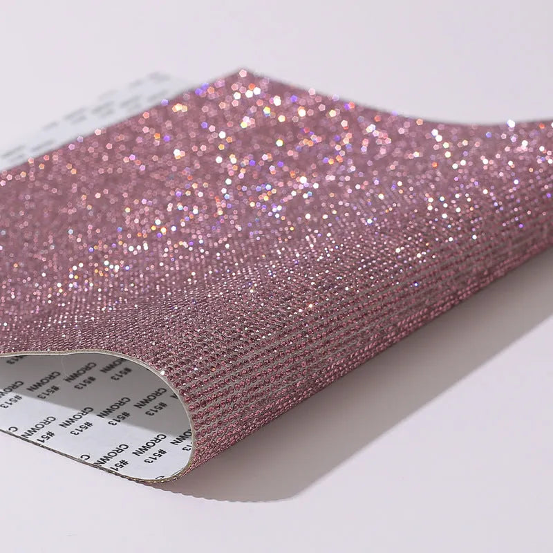 Rhinestone sticker sheet with hot drill glue backing showing eight-eye pattern stones in multiple colours