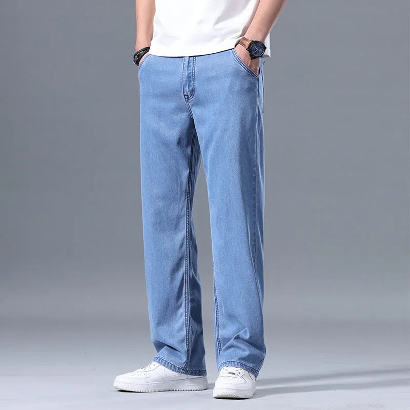 Men's loose fit straight-leg lyocell jeans in light blue colour with a zip fly.