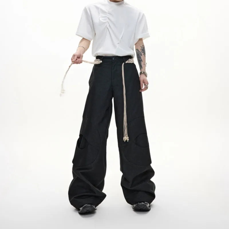 Men's dark blue cotton straight-leg jeans with loose fit, showing 3D cutting and belt stitching detail.