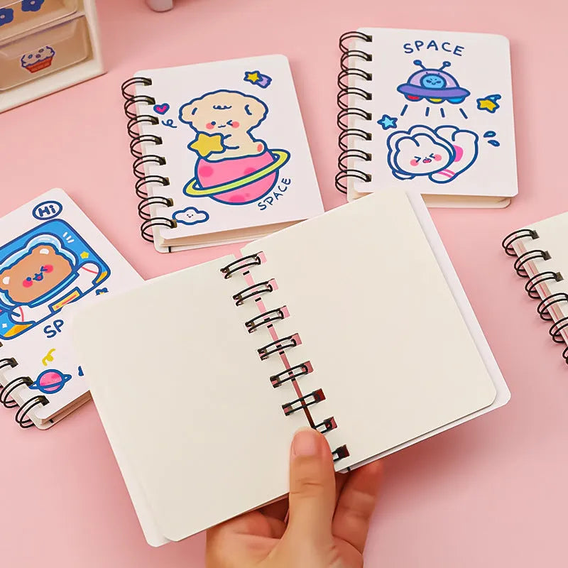 Astronaut themed flip-over pocket notebook showing 10.5cm by 8cm compact size