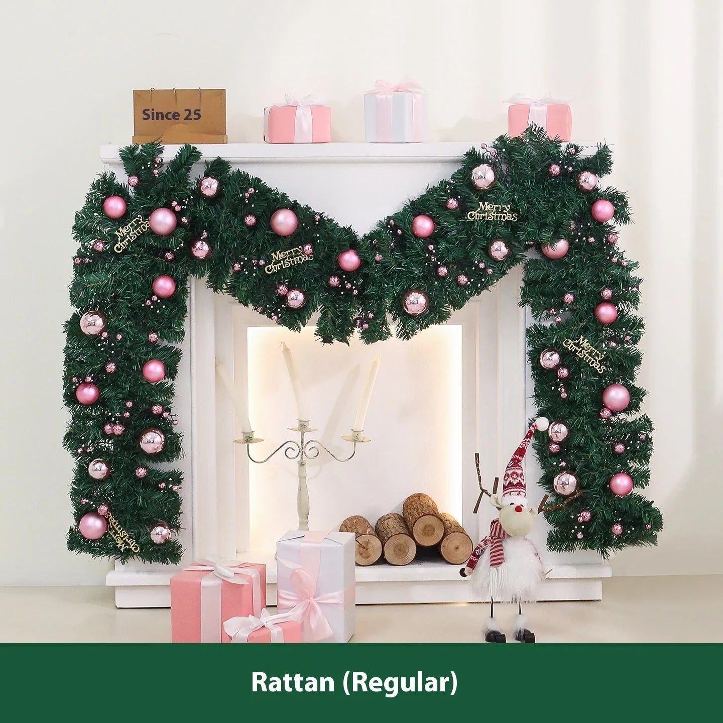 Long pink rattan Christmas garland with small fruit details and optional warm white lights draped on a mantle.