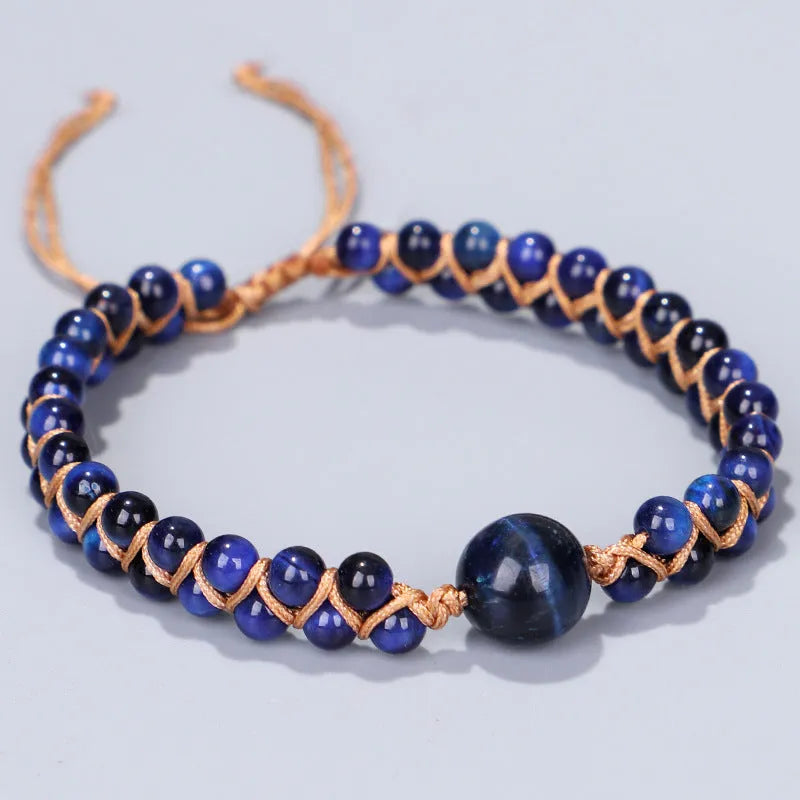Handmade woven geometric pull bracelet in blue tigereye stone with adjustable closure.