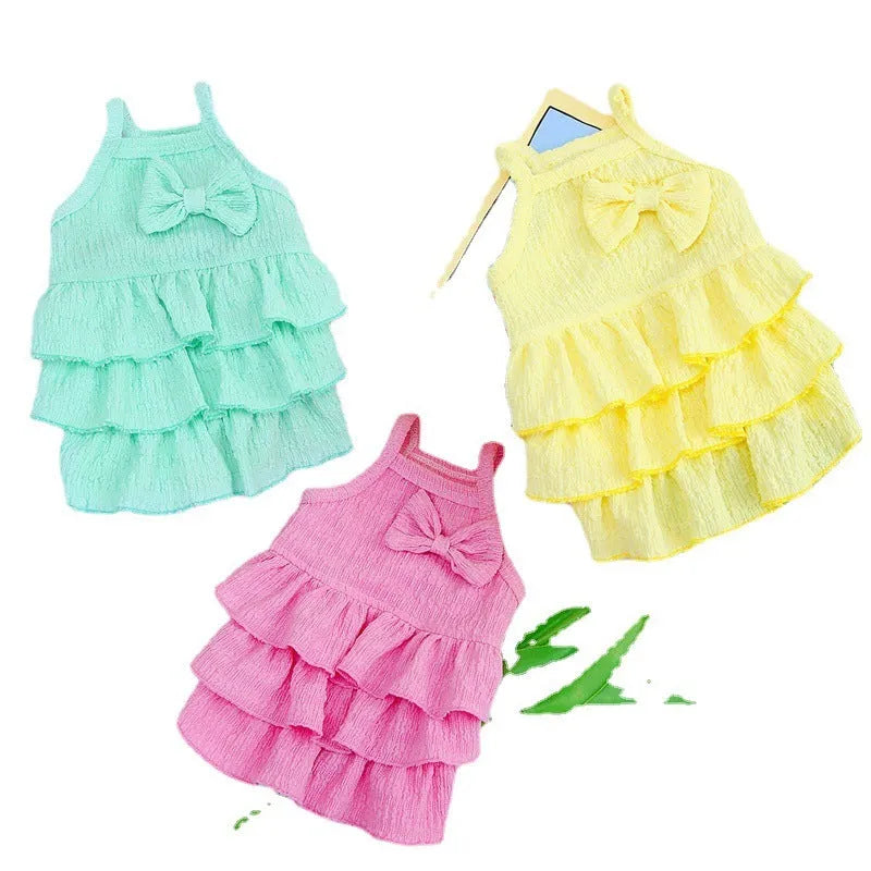 Small dog wearing princess dress with candy layered skirt in rose red colour, designed for thin teddy bichon breeds