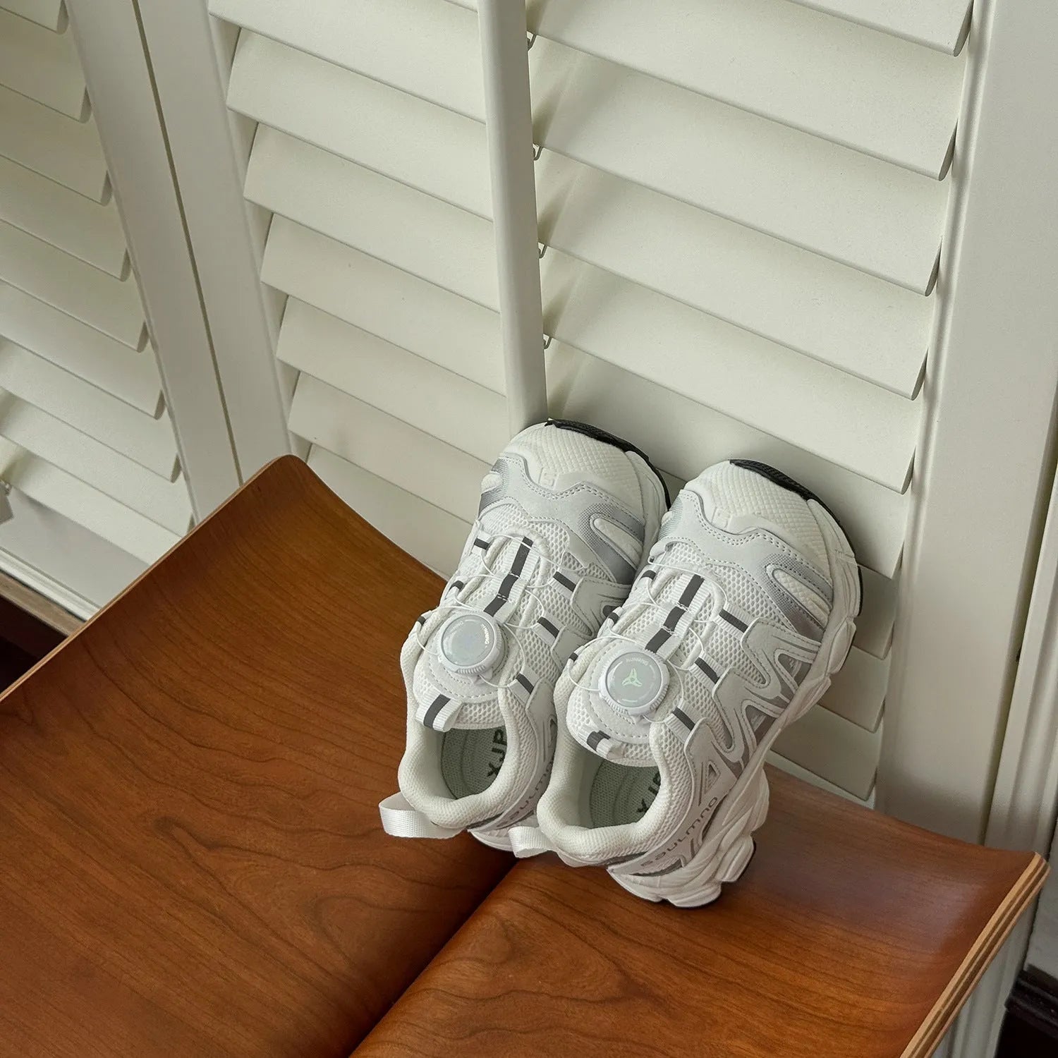 Girls lightweight casual sneaker in breathable mesh, available in black, beige, or pink.