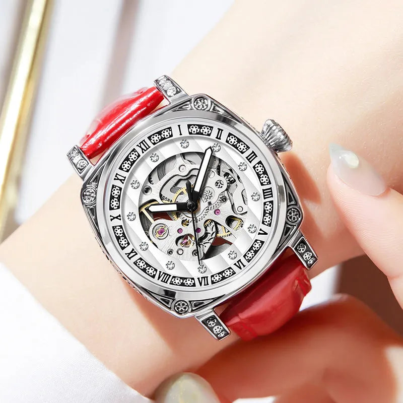 Leather strap mechanical watch with luminous hands showing black, red, steel strip and white colour options