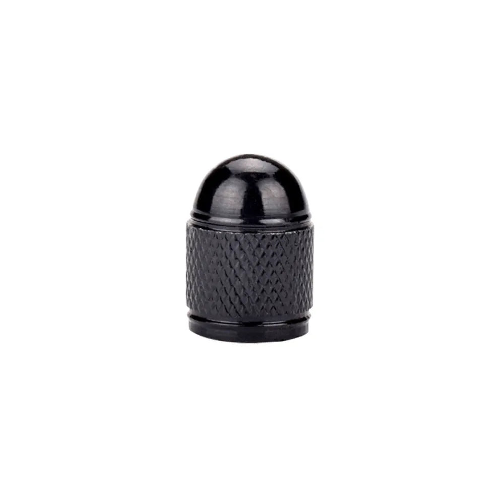 Aluminium alloy mountain bike tyre valve cap in multiple colour choices on a bicycle wheel.