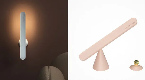 White geometric USB desk lamp with magnetic base shown on a wooden desk.