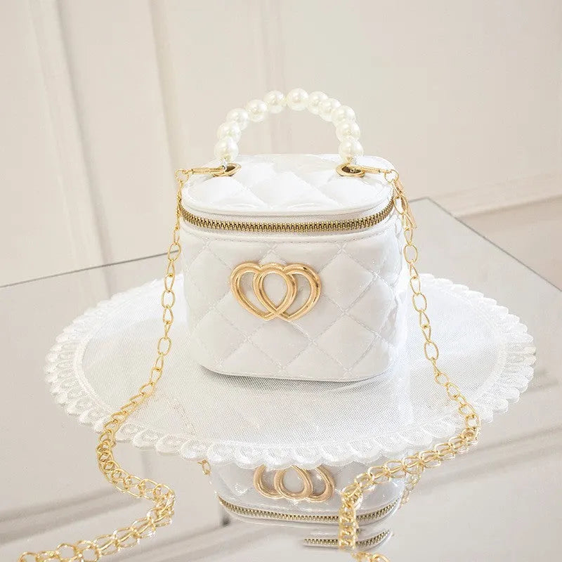 White PVC bucket-shaped gel bag with a heart pattern visible inside the open top.