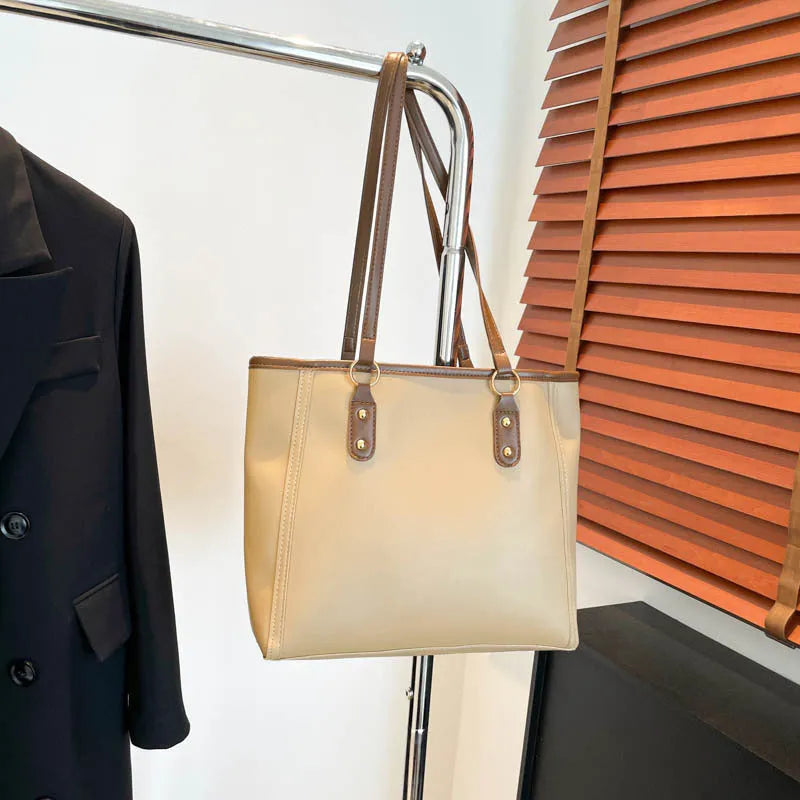 Square black PU underarm shoulder bag with a sandwich pocket design shown from the front.