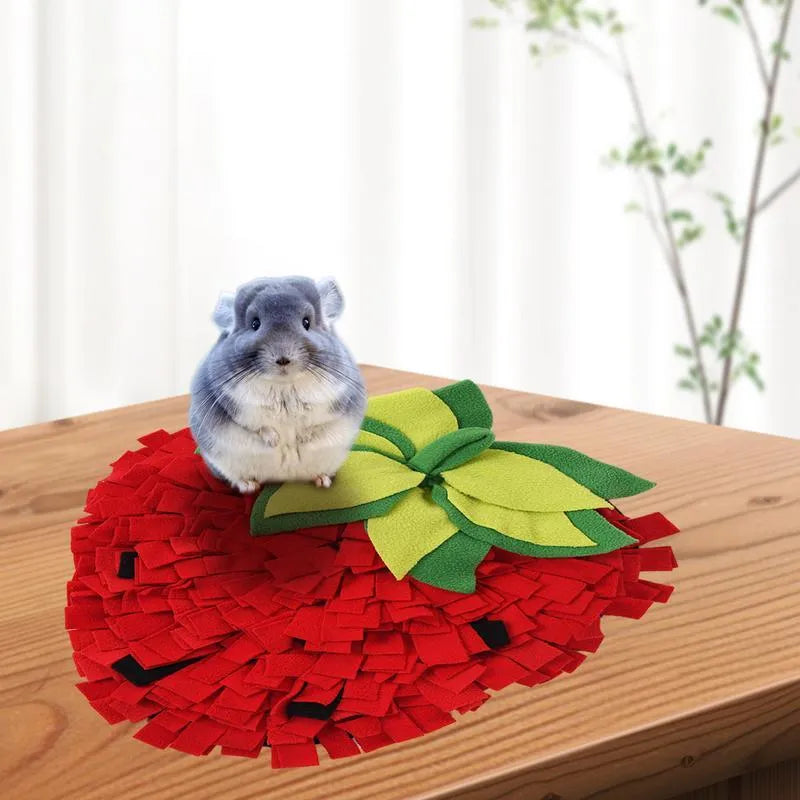Red and green strawberry-shaped pet slow feeder mat with hiding spots for interactive feeding