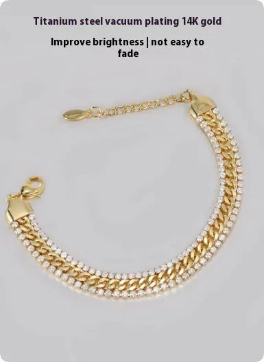 Gold tennis bracelet with artificial gemstone details on titanium steel band