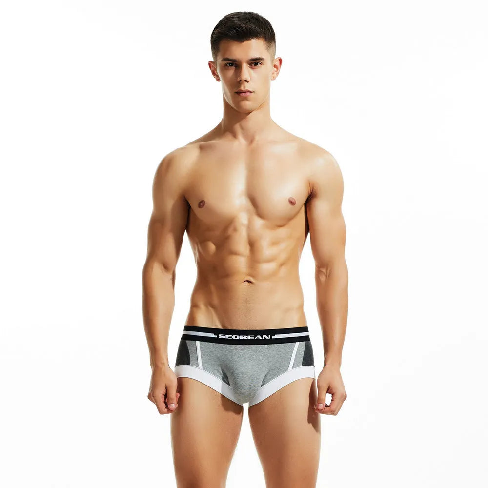 Men's cotton low waist boxers in red, dark blue, and light grey showing hip lift design