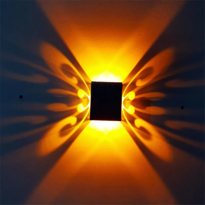 Modern aluminium LED butterfly wall lamp with remote control for seven colour options on interior wall