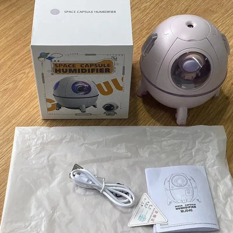 Astronaut-themed portable desktop humidifier with USB cable and colourful LED lighting
