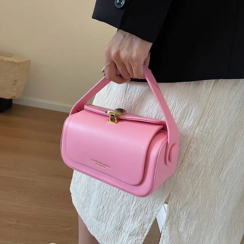 Women's personalised PU messenger bag with letter detailing in beige, shown from the front.