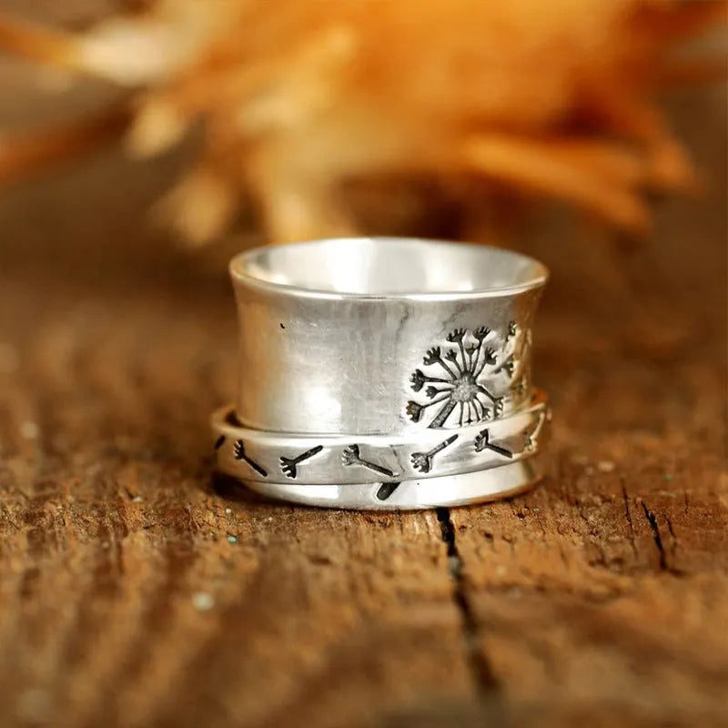 Silver electroplated rotatable flower ring showing floral design and European American sizes 7 to 11