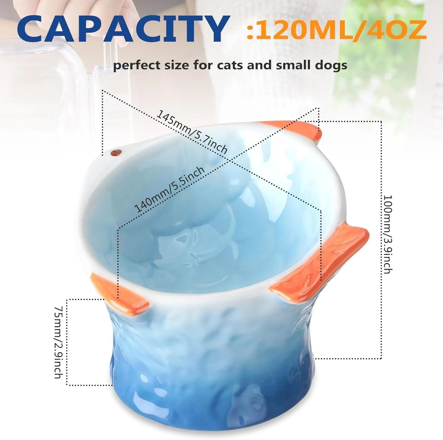 Blue ceramic fish-shaped cat bowl with tilted design and shallow eating surface on a plain background.