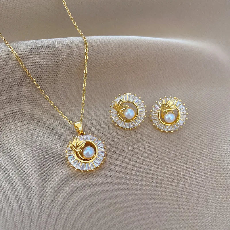 Titanium steel square diamond leaves necklace and matching stud earrings set with copper pendant and gold plating.