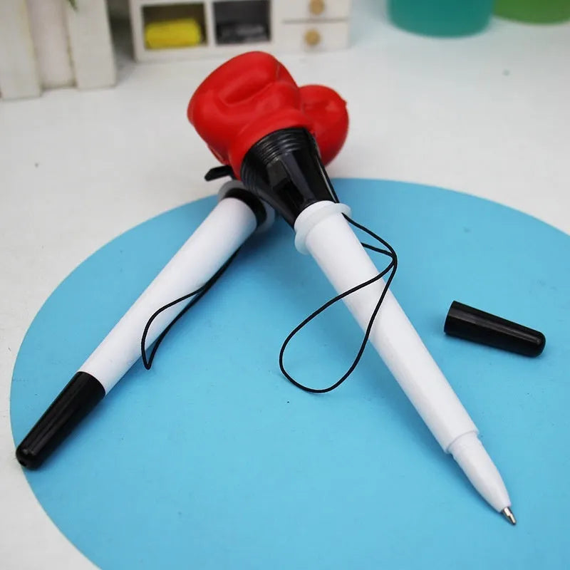 Four Creative Pressure Relief Boxing Press Ejection Pens with plug-in sleeves and black ink refills.
