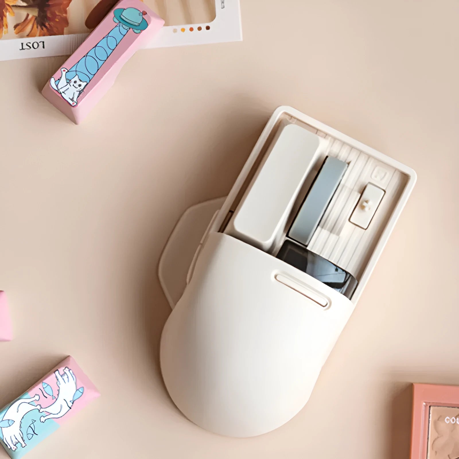 Xiaoqiao Tofu Colour wireless computer mouse with USB receiver on a desk.