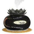 Pure black round USB-powered ultrasonic aromatherapy humidifier on desktop