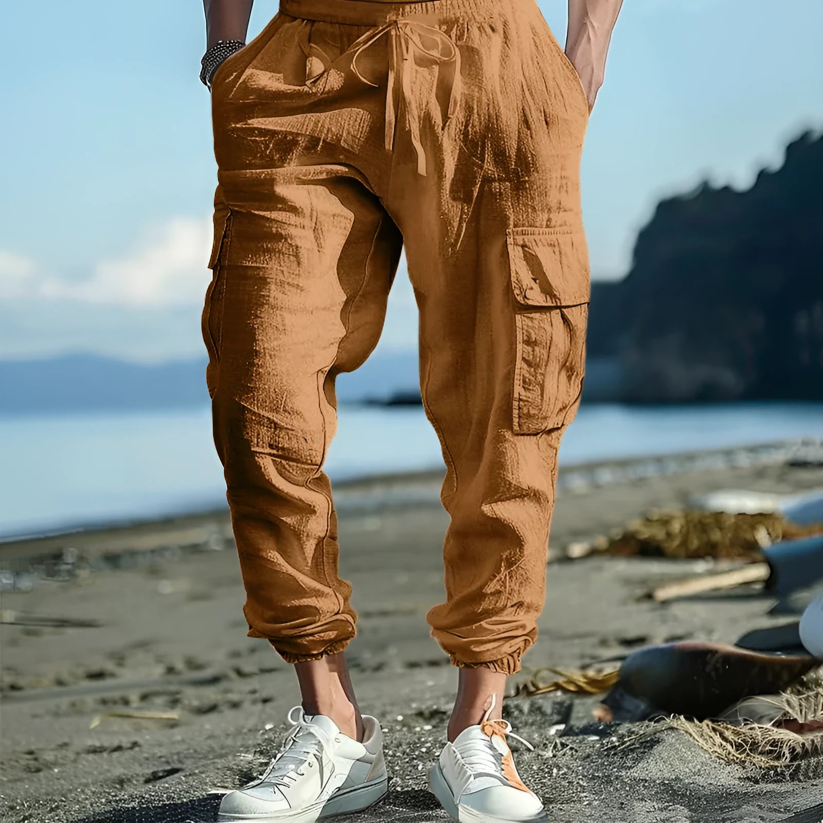 Men's solid colour linen casual trousers with ankle-tied cuffs, multiple pockets, and a drawstring waist