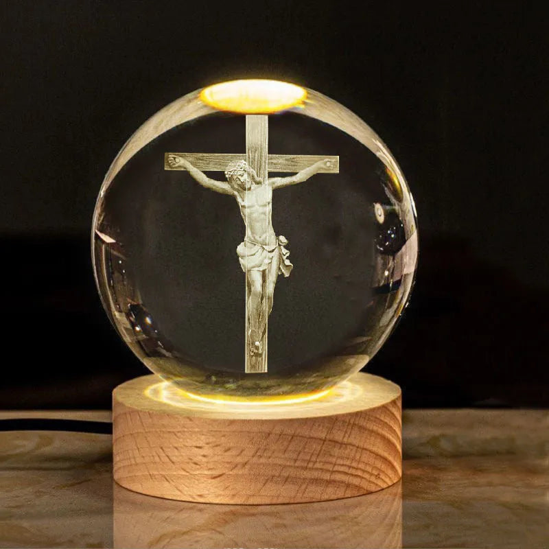 White crystal ball with cross and religious symbols on wooden LED base desk ornament