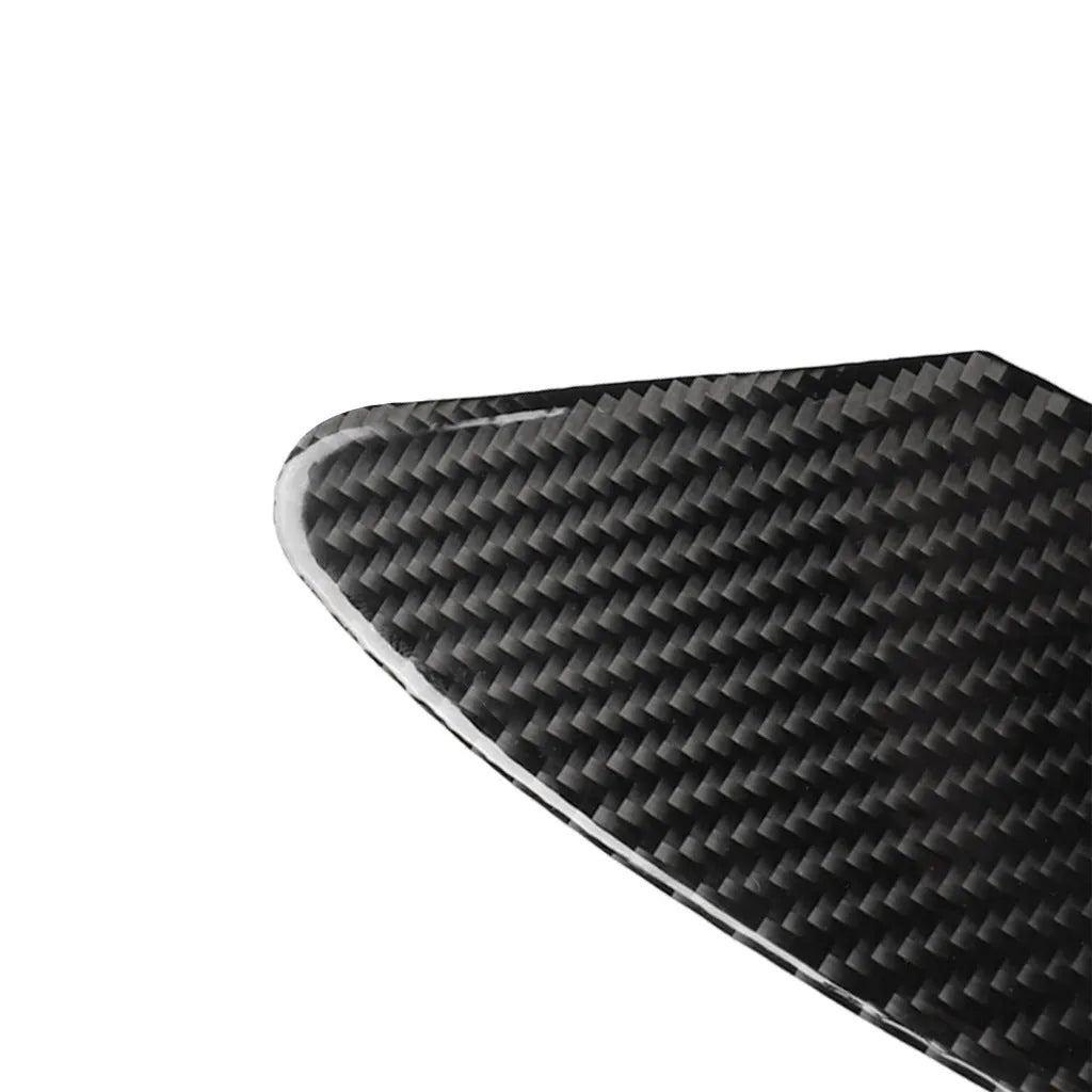 Carbon fibre decorative sticker with adhesive backing for covering a laptop or desktop USB charging port.