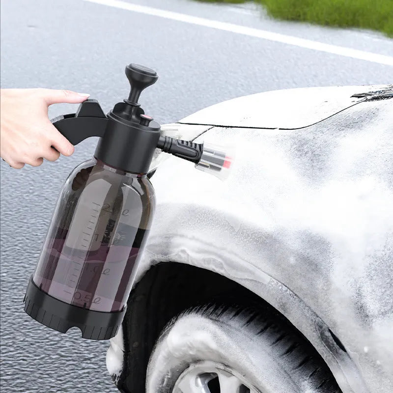 Black plastic 2-litre foam watering can sprayer with handle and spray nozzle.