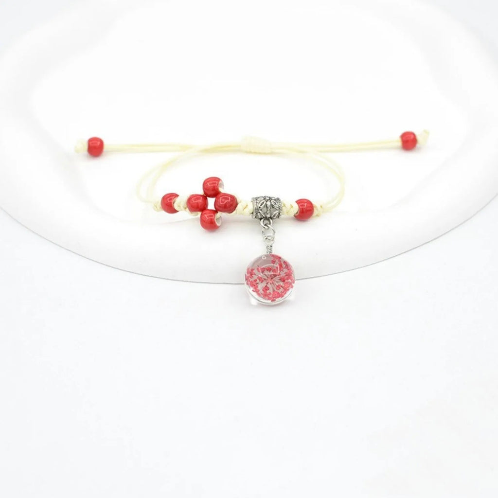 Glass dried flower bracelet with large 1.4cm beads containing real preserved flowers in hand-woven design
