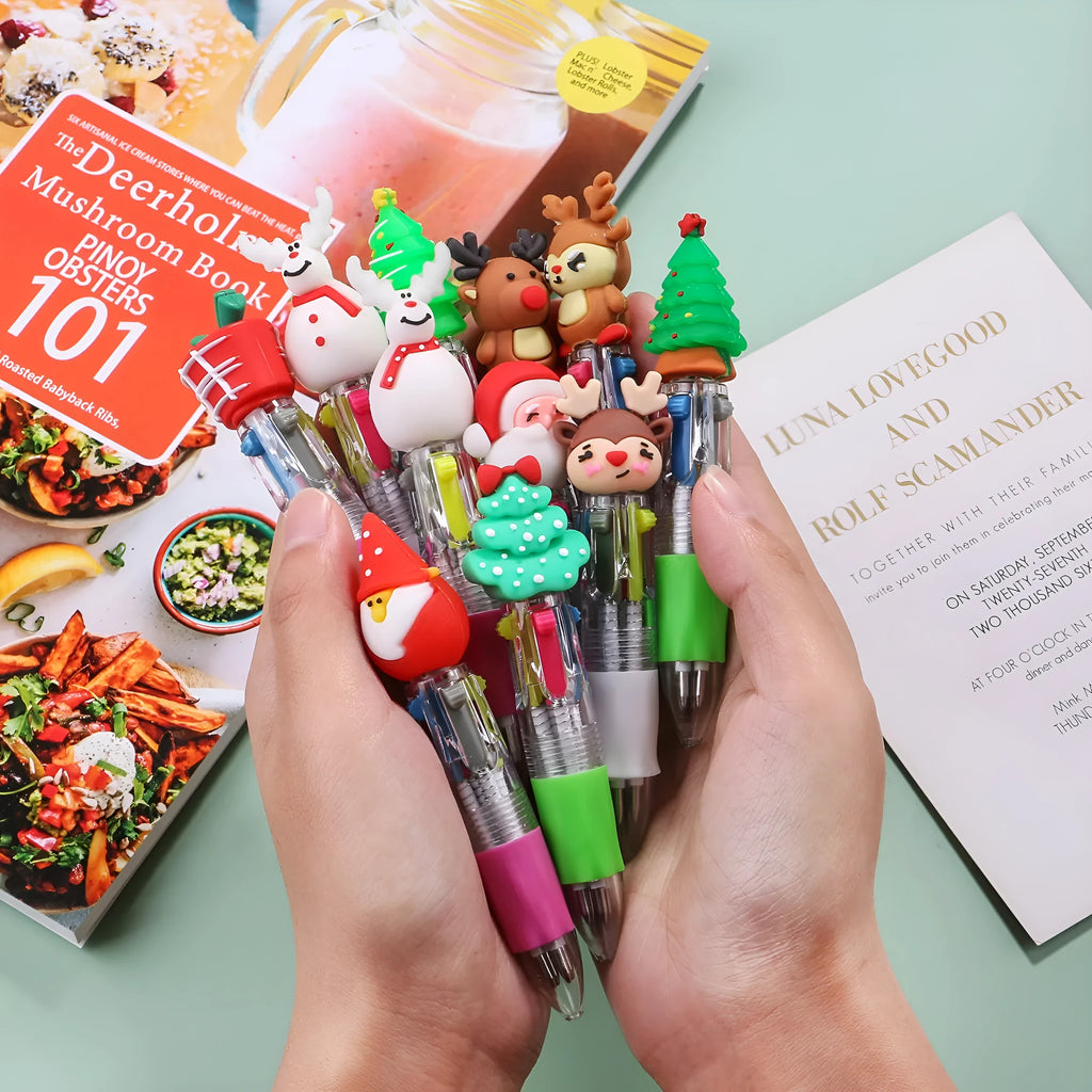 Christmas-themed ballpoint pen with press button, showing designs of snowmen, reindeer, and trees on plastic barrel.