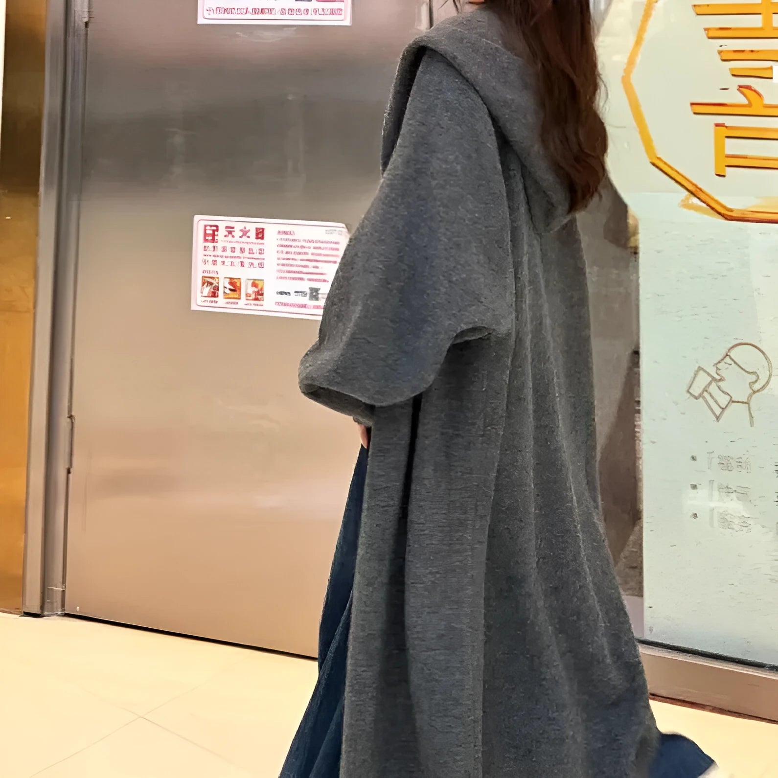 Korean style long hooded knitted cardigan coat for women in a loose free size.