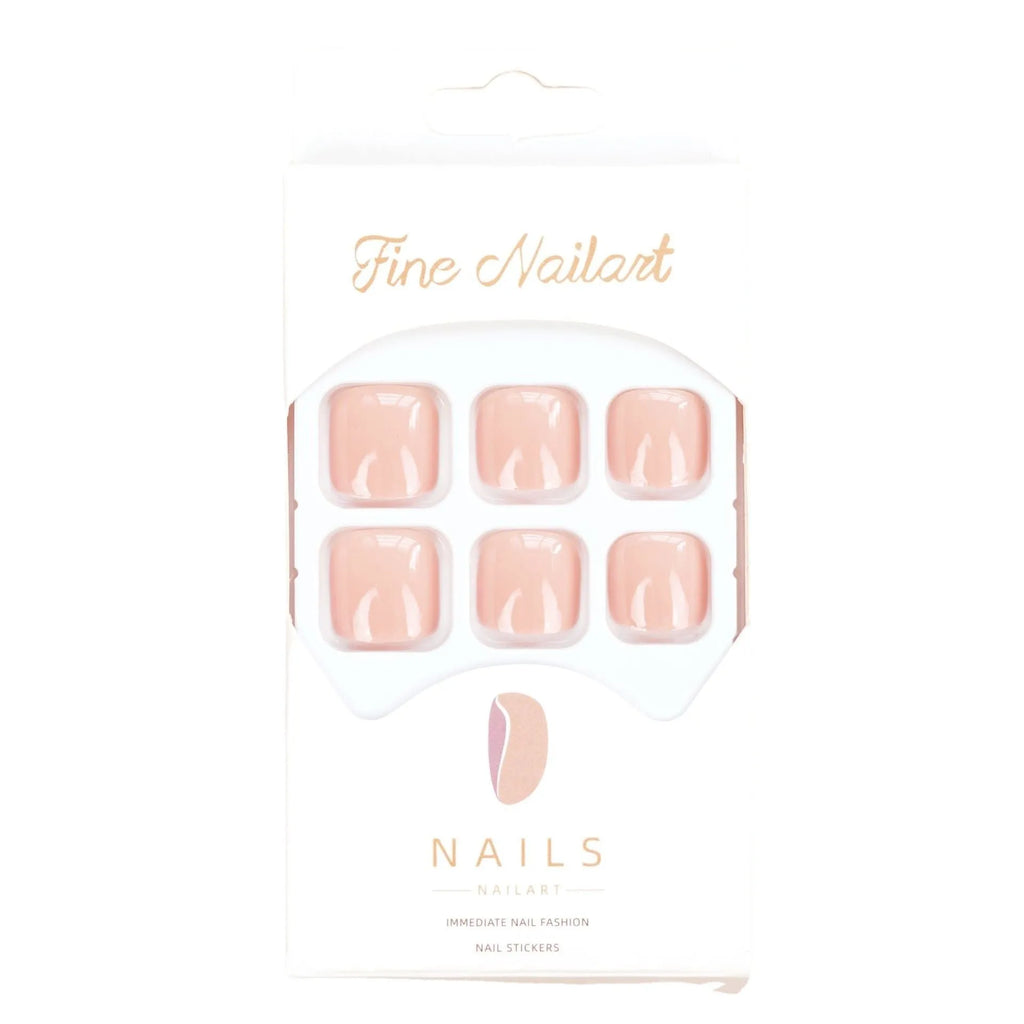 Pack of finished skin colour false toenails and a tube of adhesive glue for nail art.