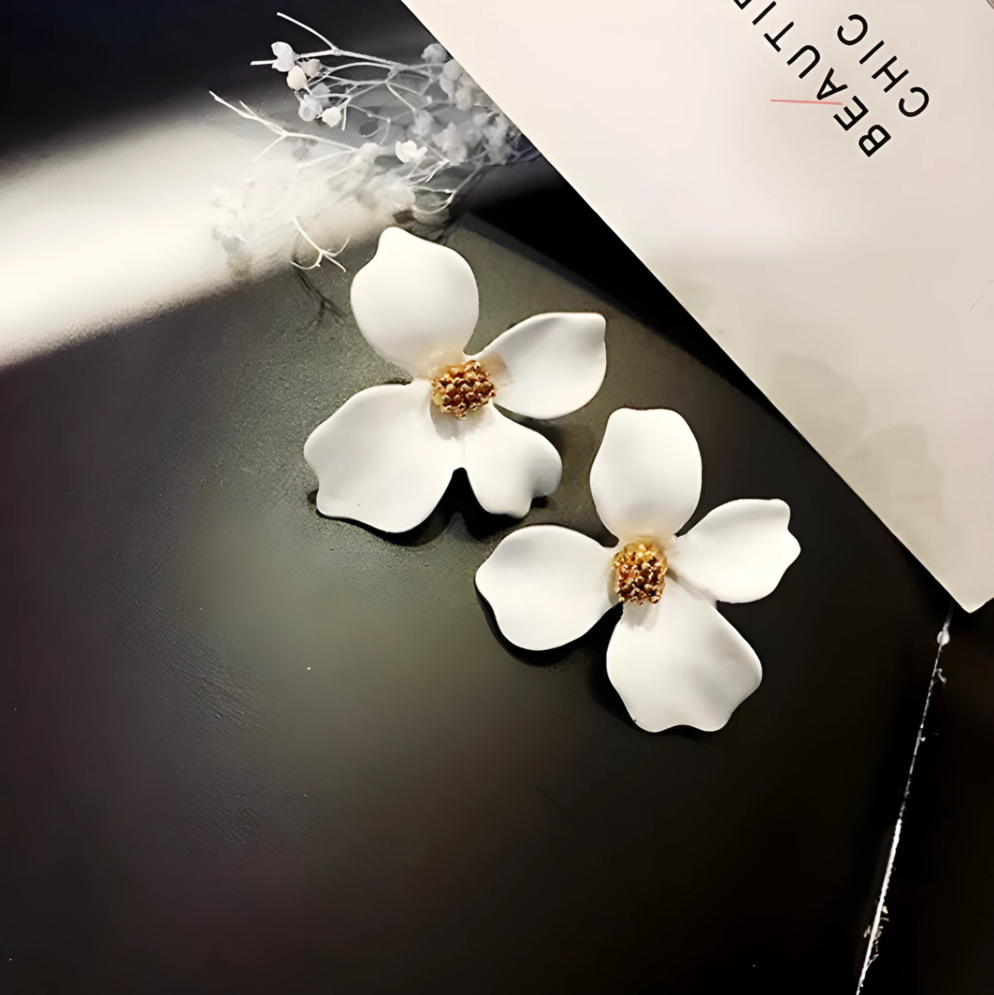 Flower shaped stud earrings for women in white or pink electroplated alloy